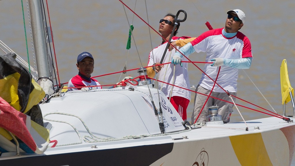Mohd Romzi Muhamad on day 3 at the Malaysian Match Racing Championships. Kuala Terengannu, Malaysia.  © Gareth Cooke - Subzero Images http://www.subzeroimages.com